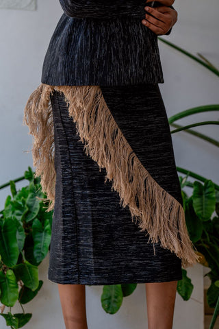 Front view of Alia Bare woven black skirt with raffia fringe on model