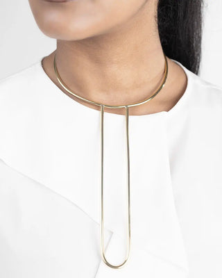 Gold necklace worn by a person on a white background available at House of NALA.