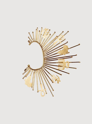 Gold earring with fan-like design on a light gray background