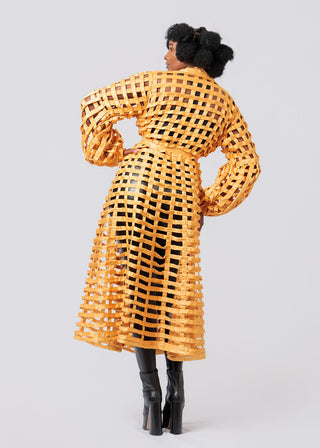 Person wearing a yellow woven coat on a plain background available at House of NALA