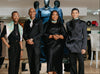 House of NALA Store Team a Group of 4 people dressed in black posing in the House of NALA store in Sandton City with mannequins and clothing in the background.