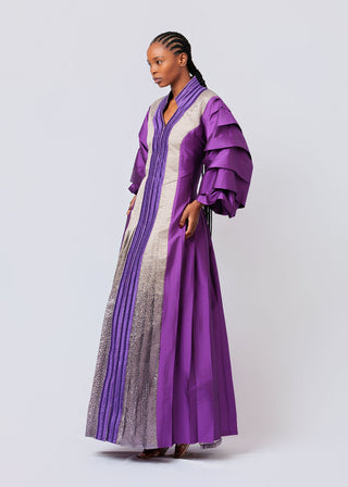 Woman wearing a long, With Embroidery Purple with ruffled sleeves on a white background