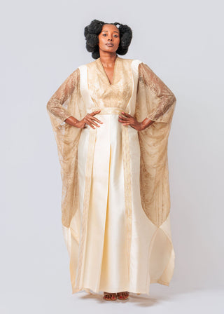 Woman wearing a beige satin dress  available at House of NALA
