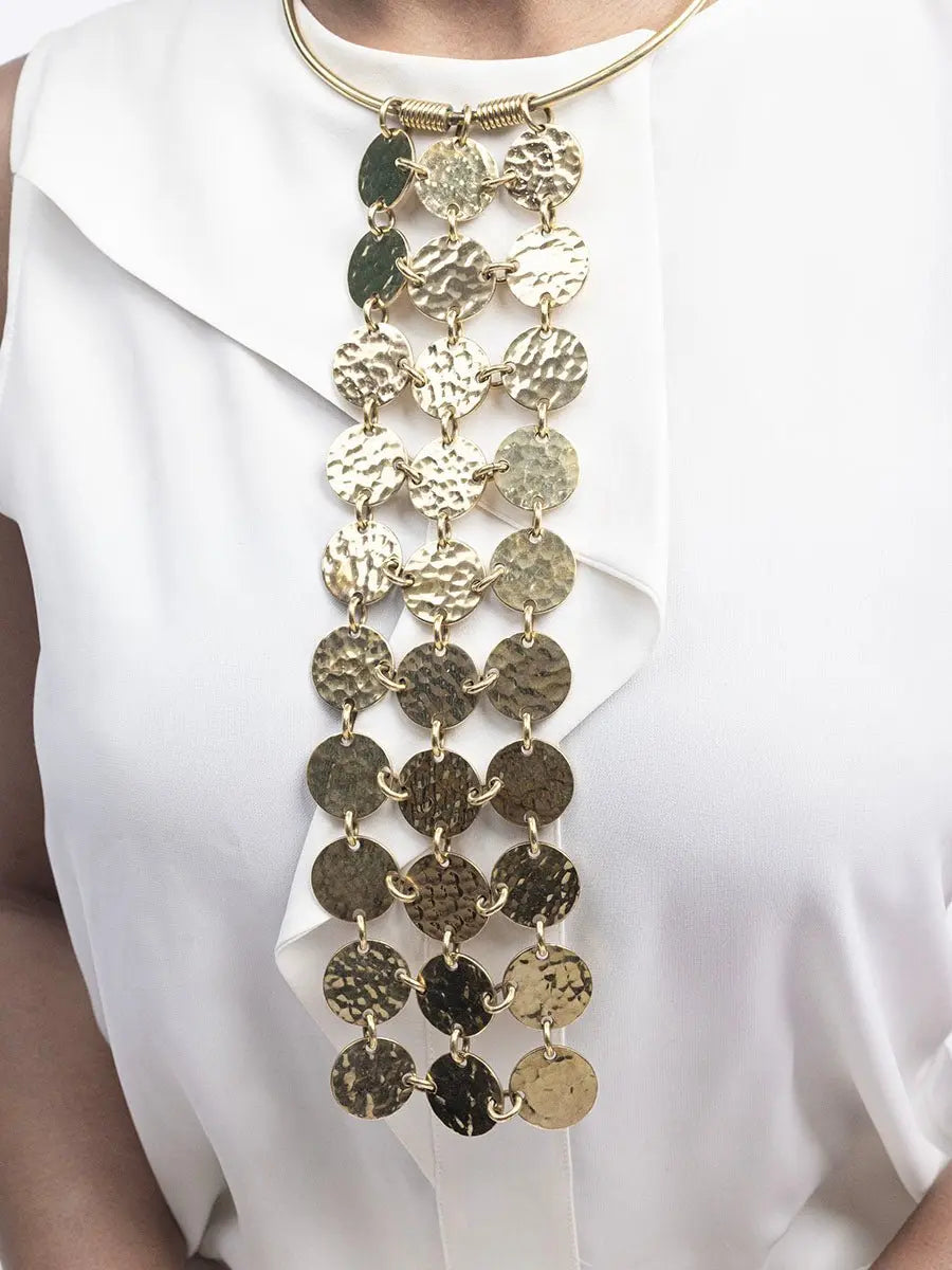 Gold necklace with circular links worn by a person on a white background available at House of NALA Sandton City.