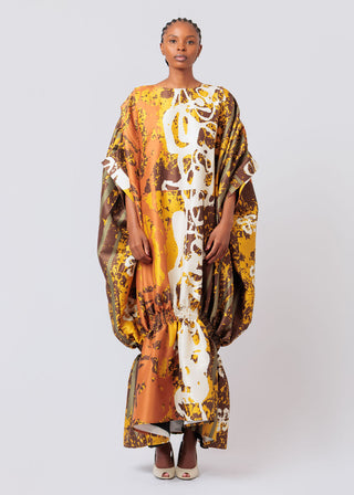 Woman wearing a colorful patterned dress on a white background