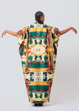 Woman wearing a colorful Mantsho Sunset Agbada Multi-Coloured
 on a white background