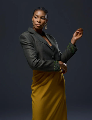 Model wearing NALAPrive_Green Beaded wrist Jacket with a yellow mustard skirt