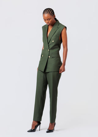 Woman wearing a olive green suit on a white background