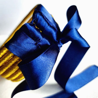 Elizabeth Morr Ndebele Yellow Choker with blue ribbon.