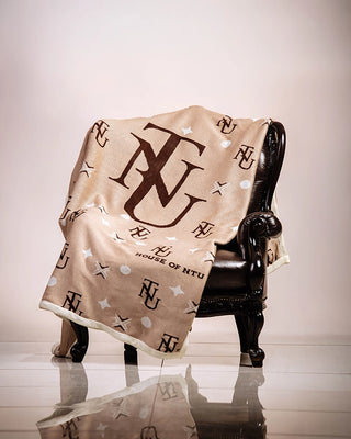 Beige, brown and white knitted shawl by House of Ntu. 