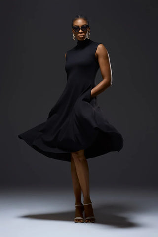 Model Nala Prive Knit Turtleneck Dress with open toe white heel shoes.