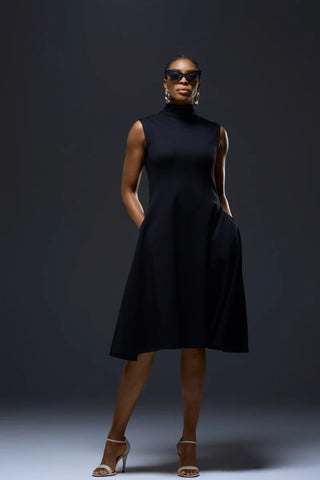 Model Nala Prive Knit Turtleneck Dress with open toe white heel shoe.