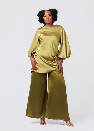 Woman wearing a green satin top and pants outfit on a white background available at House of NALA