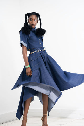 Model wearing NALA Privé denim wrap skirt and cropped shirt showing asymmetrical shape