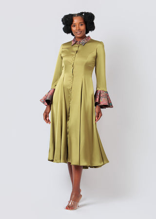 Woman wearing a Olive green Satin Shirtdress with patterned cuffs on a white background