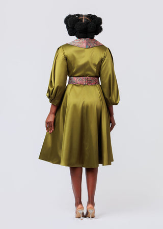 Person wearing a Olive green dress with a belt on a white background 