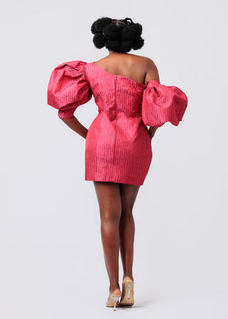 Person wearing a pink off-shoulder mini dress with puff sleeves on a white background available at House of NALA