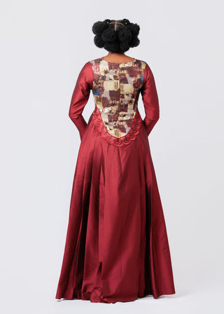 Red evening gown with patterned back on a white background