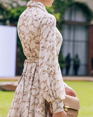 Close-Up back detail of long sleeve floral maxi dress with collar detail.