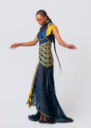 Woman wearing a blue and yellow patterned dress on a white background