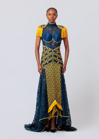 Woman wearing a blue and yellow patterned dress on a white background