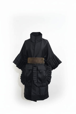 Black dress with a gold belt on a white background
