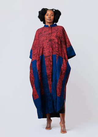 Woman wearing a burgundy and blue patterned shirt dress on a white background
