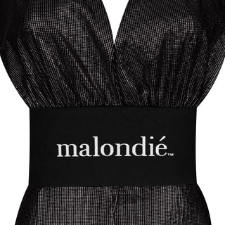 Black dress with a visible 'malondié' label on a white background
